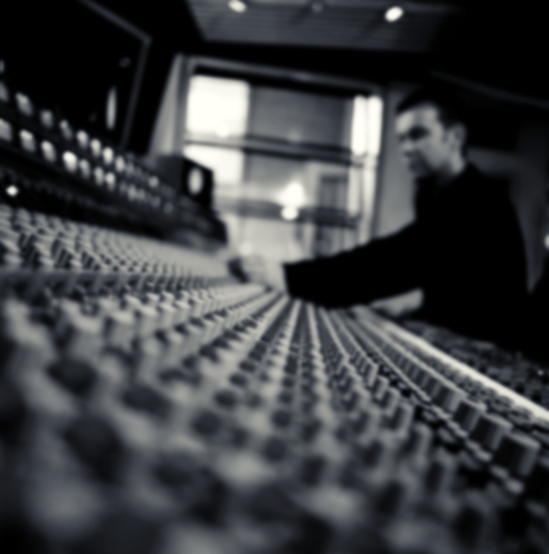 Recording studio technician at mixing console